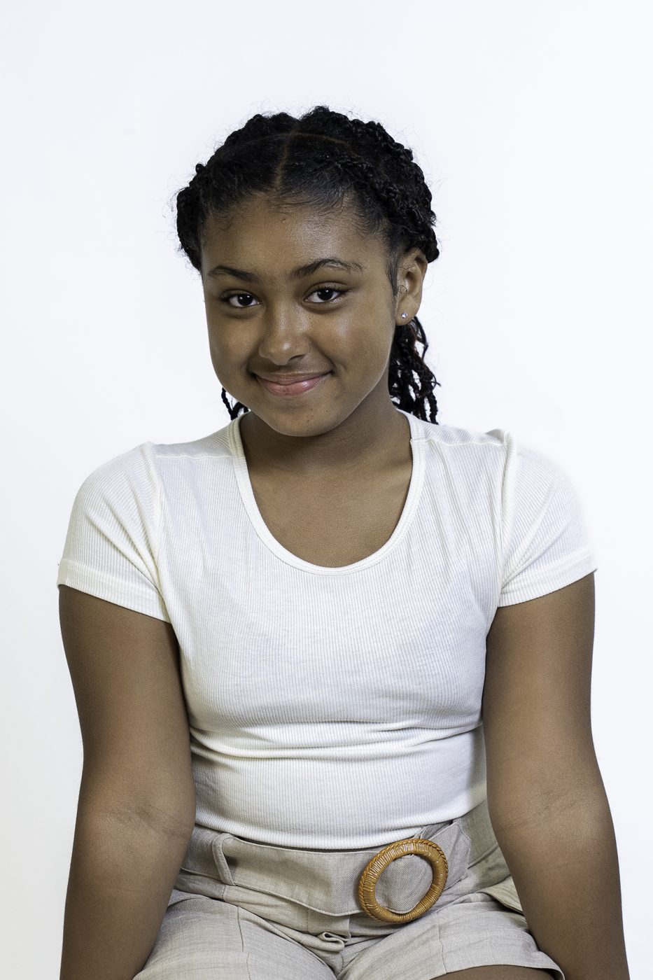 Eleaya Neveah seated print modeling photo, cream top and linen shorts